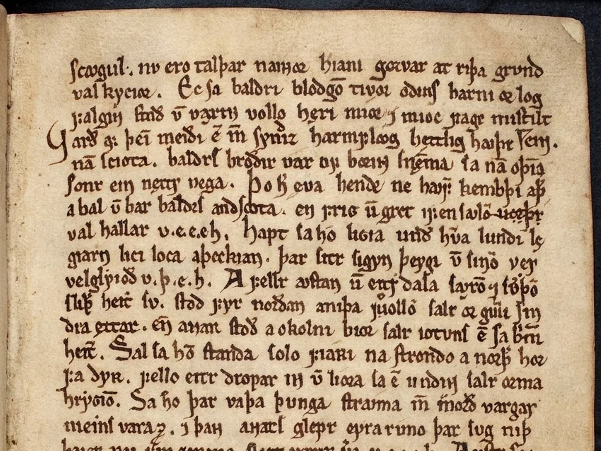 The same Norse vellum leaf after cleaning, the ink legible against a lightened parchment ground
